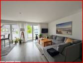 Wohnzimmer mit Zugang zum Balkon - 