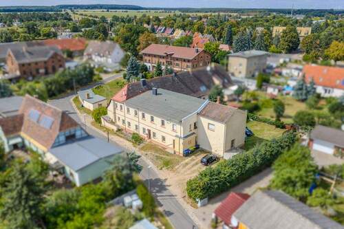 Aufnahme aus der Vogelperspektive - Mehrfamilienhaus, Wohnhaus mit 443,00 m² in Bad Schmiedeberg zum Kaufen
