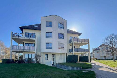 Objektansicht - Vermietete 2-Zi.-Wohnung mit Eckbalkon und TG-Stellplatz in Dresden-Gompitz