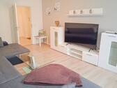 Wohnzimmer - Moderne 2-Zimmer-Wohnung mit hochwertiger Ausstattung und ca. 65 m² Wohnfläche