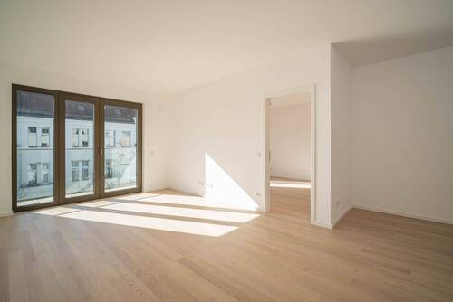 Wohnbereich - Moderne 2-Zimmer-Wohnung mit Balkon und bodentiefen Fenstern