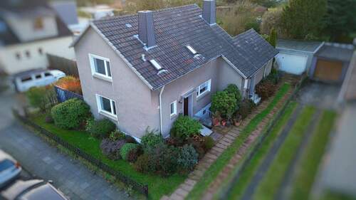 Seitenansicht - Einfamilienhaus mit 136,00 m&sup2; in Leverkusen zum Kaufen