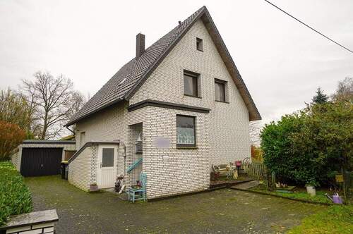 Front - 5 Zimmer Mehrfamilienhaus, Wohnhaus zum Kaufen in Gütersloh / Hollen