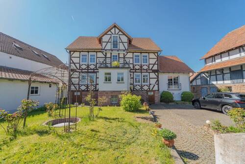 Frontansicht mit Vorgarten - 1 Zimmer Einfamilienhaus zum Kaufen in Neustadt (Hessen) / Speckswinkel