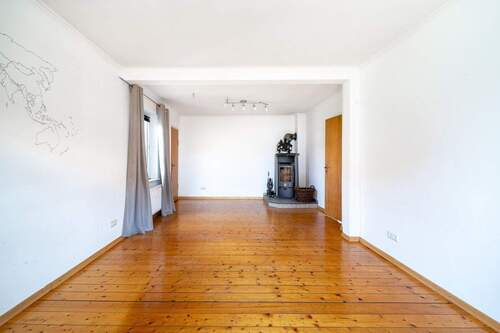 Vorderhaus Wohnzimmer EG - Einfamilienhaus mit 248,00 m&sup2; in Schloß Holte-Stukenbrock zum Kaufen