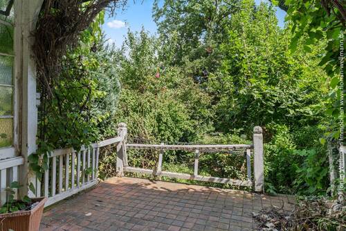 Terrasse (12,80m²/6,40m² Wfl.) mit Zugang zum ... - 