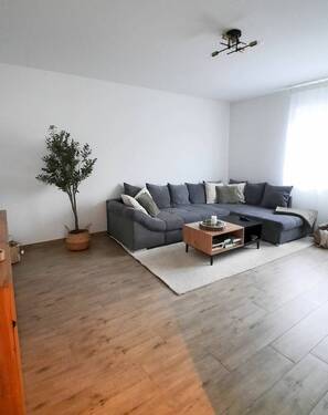 Wohnzimmer - Doppelhaushälfte mit 87,00 m² in Ostrhauderfehn zur Miete