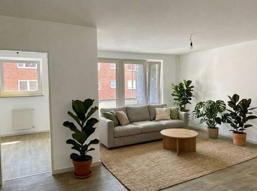 Wohnzimmer Beispielbild - AB SOFORT: MIETFREIE ZEIT IN BRUNSBÜTTEL Renovierte 2-Zimmer-Wohnung + Balkon OTTO STÖBEN GmbH