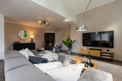 Wohnbereich mit Kamin - Einfamilienhaus mit 132,30 m² in Oldenburg zum Kaufen