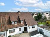 Ansicht Nord mit Eingang und Garage - 