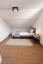 Schlafzimmer 3 im Dachgeschoss - 