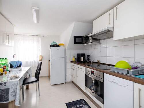 Separate Küche mit Essbereich im Dachgeschoss - 