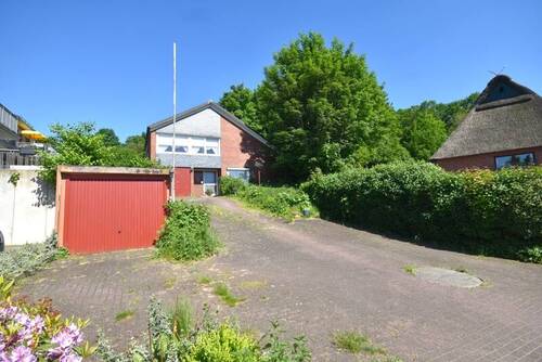 Straßenansicht I - 4 Zimmer Einfamilienhaus zum Kaufen in Oelixdorf