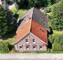 Teilvermietetes Zweifamilienhaus mit Nebengebäude sowie Wald- und Seegrundstück - Großefehn Ostgroßefehn