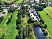 Luftbild - Mehrfamilienhaus, Wohnhaus mit 210,00 m&sup2; in Großefehn zum Kaufen