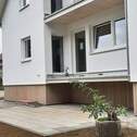 Etage mit Balkon - 4-Zimmer Wohnung Haus Erstbezug - ideal für Familien - mit großem Garten am Bach