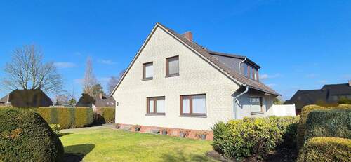 Hausansicht - Zweifamilienhaus mit Doppelgarage und Keller im ruhigen Wohngebiet in Sottrum zu verkaufen