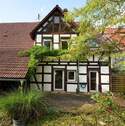 Rückseite mit Terrasse - Charmantes Bauernhaus mit Scheune, Garten & Potenzial - gewerblich nutzbar