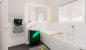 Im hellen Bad mit Badewanne und Dusche starten Sie entspannt in den Tag und lassen ihn in Ruhe ausklingen - 