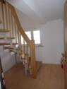 Treppe vom Eingang zu Wohnen - 