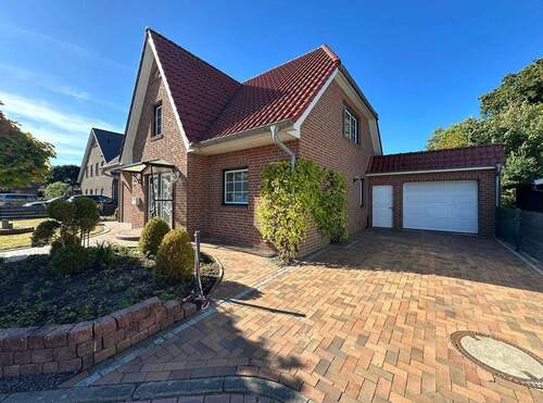 Seitenansicht mit Garage - 5 Zimmer Einfamilienhaus zum Kaufen in Wangerland