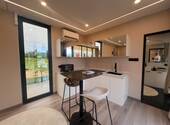 Kompakte Designküche mit Panoramaverglasung - Moderne Wohnlichkeit auf kleinstem Raum - Mehrfamilienhaus, Wohnhaus mit 50,00 m² in Ering am Inn zum Kaufen