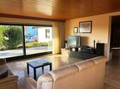Wohnzimmer mit Ausgang zur Terrasse - Bungalow mit 155,00 m&sup2; in Schonungen zum Kaufen