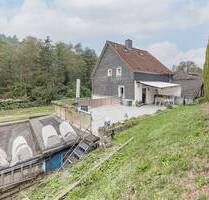 Vermietung und Selbstnutzung: Mehrfamilienhaus mit 7 Einheiten, Kfz-Stellplätzen und Garagen - Wuppertal Beyenburg