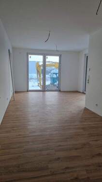 Wohnzimmer - Erstbezug in Voxtrup: Exklusive 2ZKB EG-Wohnung mit Terrasse + Stellplatz im Neubau