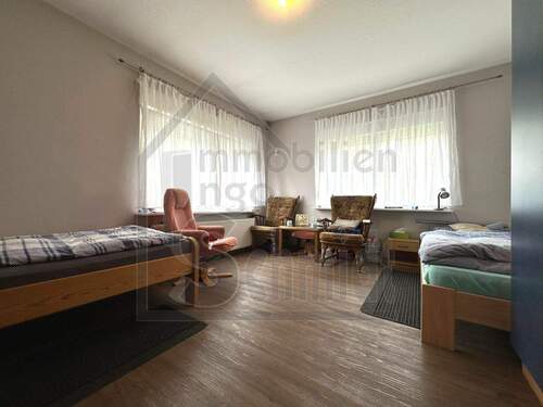 Wohnzimmer - Mehrfamilienhaus, Wohnhaus mit 170,00 m² in Weener zum Kaufen