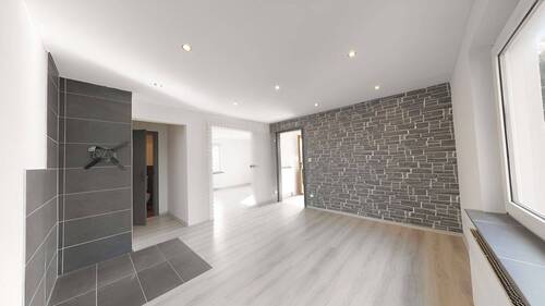Wohnzimmer - Mehrfamilienhaus, Wohnhaus mit 620,00 m&sup2; in Sassenburg zum Kaufen
