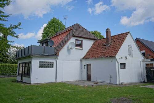 Seitenansicht mit Wintergarten - 6 Zimmer Einfamilienhaus in Schiffdorf