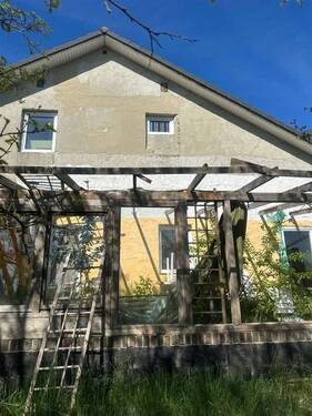 West Ansicht - 8 Zimmer Einfamilienhaus zum Kaufen in Maasen