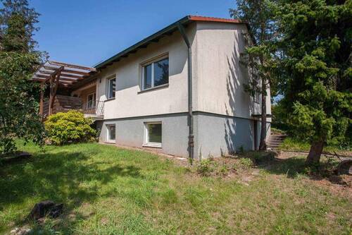 Seitenansicht - Einfamilienhaus mit 100,00 m² in Erlangen zum Kaufen