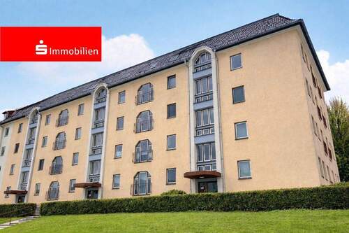 Hausansicht - Investmentchance: vermietete Wohnung mit Balkon und Stellplatz