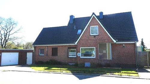 Außenansicht - +++ Geräumiges Siedlungshaus mit großem Garten, Garage und Carport, in ruhiger Lage +++