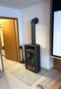 Kaminofen im Wohnzimmer UG - 