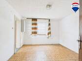 RE/MAX Immobilien DeLux Einfamilienhaus Merzig Wohnzimmer - 