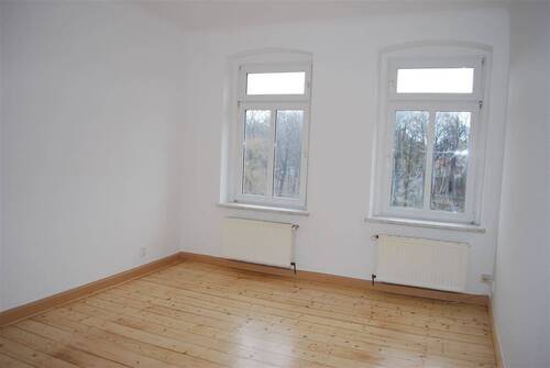 Zimmer mit aufgearbeiteten Dielen - 
