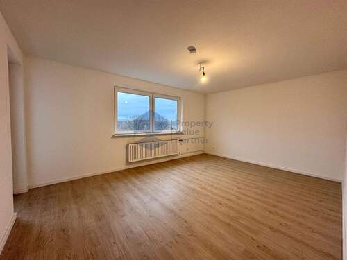 Wohnzimmer - 2-Zimmer-Wohnung im 6. Obergeschoss mit West-Loggia