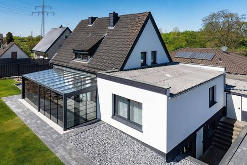 Rückansicht mit Wintergarten - 5 Zimmer Einfamilienhaus zum Kaufen in Beckum
