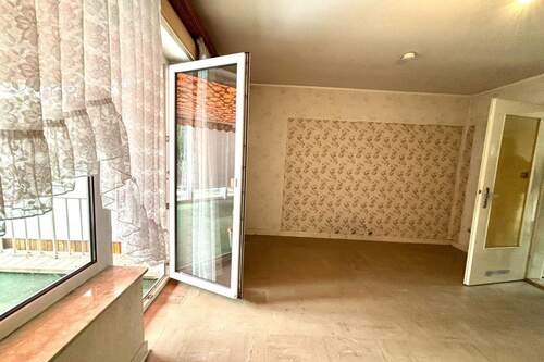 Wohnzimmer mit ZUgang zum Wintergarten - 