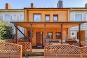 Titelbild Exposé - Modernisiertes und familienfreundliches Reihenmittelhaus mit Garten, Terrasse und Wintergarten