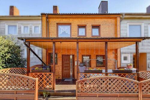 Titelbild Exposé - Modernisiertes und familienfreundliches Reihenmittelhaus mit Garten, Terrasse und Wintergarten