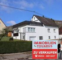 Einfamilienhaus mit separater Wohnung im Dachgeschoss, 2 Garagen, Terrasse, Garten, Keller - Freisen Oberkirchen