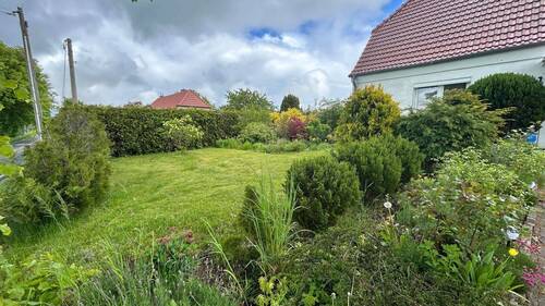 angelegter Garten - Einfamilienhaus mit 160,00 m&sup2; in Vorbeck zum Kaufen