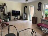 Wohnzimmer mit Specksteinofen - 