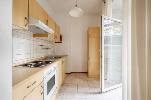 Küche mit Austritt zur Terrasse - 1 Zimmer Etagenwohnung zum Kaufen in Berlin