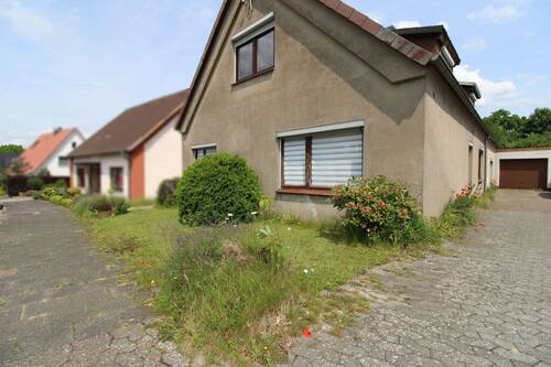 Vorderansicht 1.2 - 7 Zimmer Einfamilienhaus zum Kaufen in Geestland