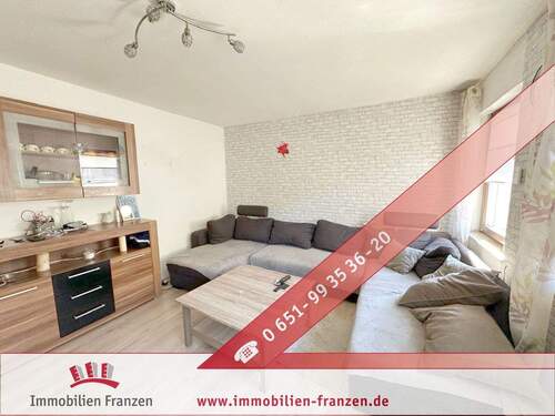 Titelbild - Riveris: raus aus der Miete, ab ins eigene Haus mit gut vermietetem Einlieger-Apartment, Garten & Doppelgarage!